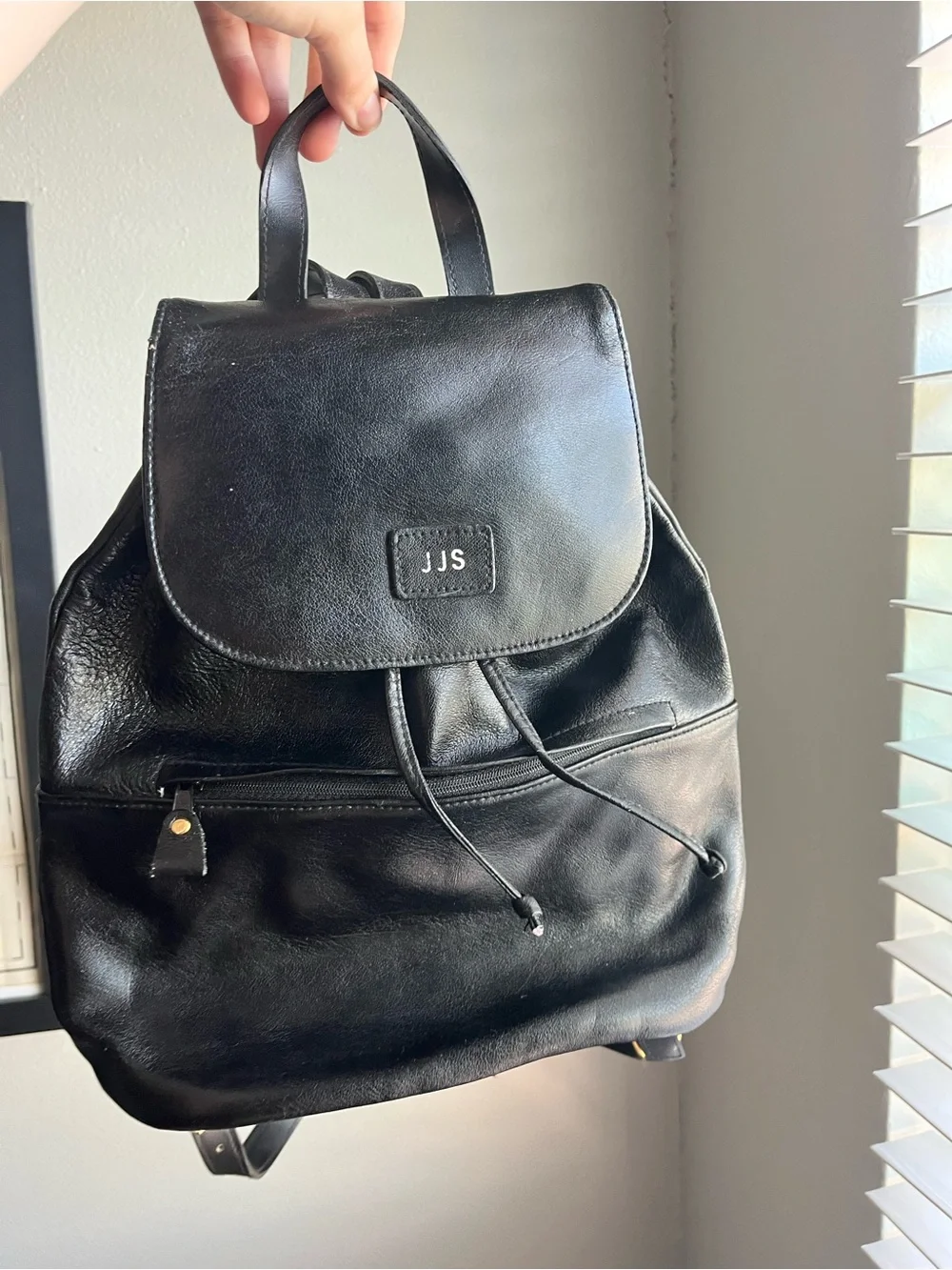 JJs House Black Leather Drawstring Flap Backpack